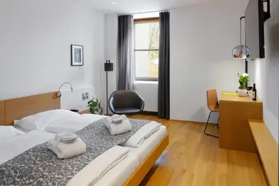 Ein Bett oder Betten in einem Zimmer der Unterkunft Hotel Schloss Hernstein