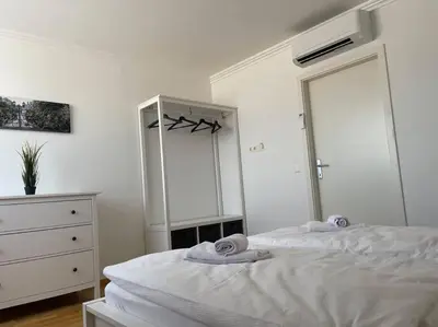 Ein Bett oder Betten in einem Zimmer der Unterkunft Dachgeschoss für 4 mit Terrasse