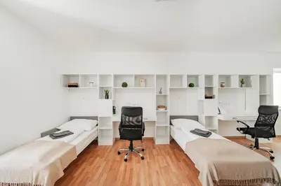 Ein Bett oder Betten in einem Zimmer der Unterkunft Central City Suits