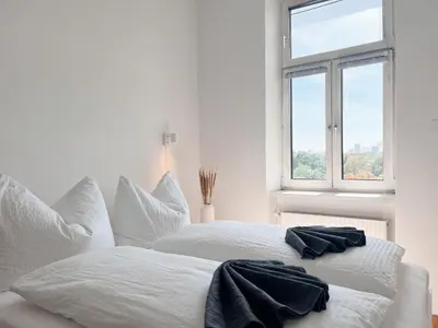 Ein Bett oder Betten in einem Zimmer der Unterkunft New City Apartment