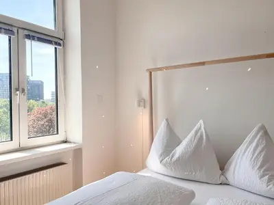 Ein Bett oder Betten in einem Zimmer der Unterkunft New City Apartment