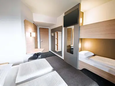 Ein Bett oder Betten in einem Zimmer der Unterkunft B&B HOTEL Wiener Neudorf