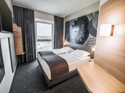 Ein Bett oder Betten in einem Zimmer der Unterkunft B&B HOTEL Wiener Neudorf