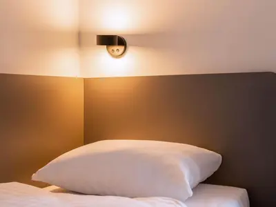 Ein Bett oder Betten in einem Zimmer der Unterkunft B&B HOTEL Wiener Neudorf