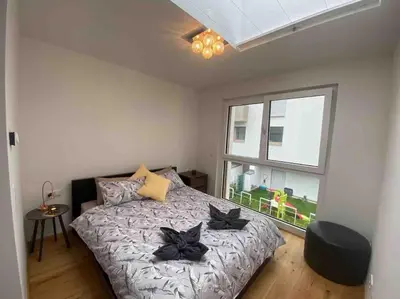 Ein Bett oder Betten in einem Zimmer der Unterkunft Wiener Townhouse Schönbrunn