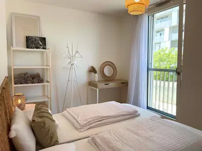 Ein Bett oder Betten in einem Zimmer der Unterkunft Urban Oasis: Stylische Wohnung