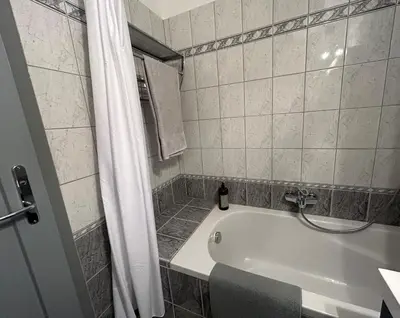 Ein Badezimmer in der Unterkunft Apartment Wien West
