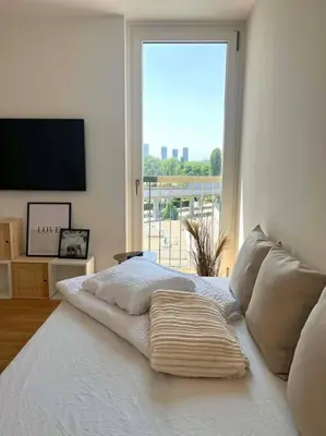 Ein Bett oder Betten in einem Zimmer der Unterkunft Donaublick Oasis: Stylische Wohnung