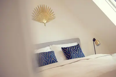Ein Bett oder Betten in einem Zimmer der Unterkunft The 77 ANNA