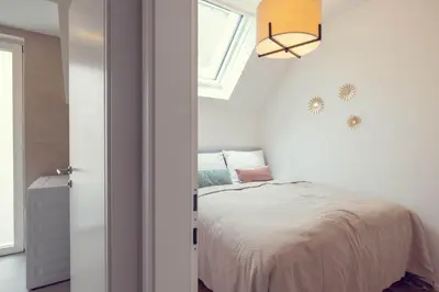 Ein Bett oder Betten in einem Zimmer der Unterkunft The 77 ANNA