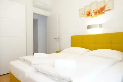 Ein Bett oder Betten in einem Zimmer der Unterkunft Apartments 4 you Red Star 8