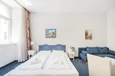 Ein Bett oder Betten in einem Zimmer der Unterkunft Self-Check-In Hotel Adlon
