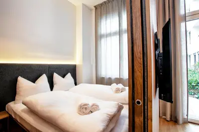 Ein Bett oder Betten in einem Zimmer der Unterkunft FERDI Margareten