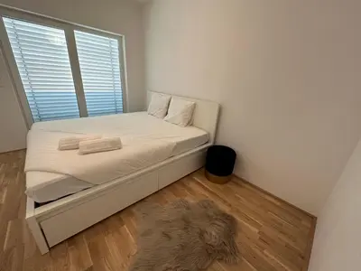 Ein Bett oder Betten in einem Zimmer der Unterkunft New Apartment with Spacious Balcony 18