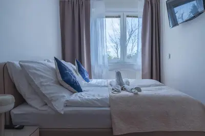 Ein Bett oder Betten in einem Zimmer der Unterkunft Comfort Collection Podersdorf am See