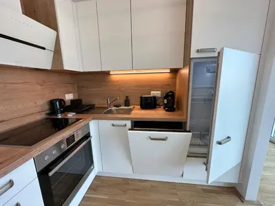Küche/Küchenzeile in der Unterkunft Contemporary Apartment with Stunning Views 20