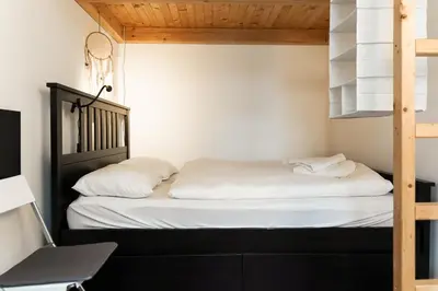 Ein Bett oder Betten in einem Zimmer der Unterkunft Margarete Family Stay
