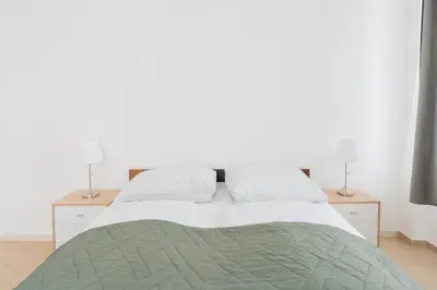 Ein Bett oder Betten in einem Zimmer der Unterkunft New Favoriten - Serviced Apartments