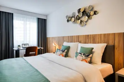 Ein Bett oder Betten in einem Zimmer der Unterkunft Somerset Schönbrunn Vienna