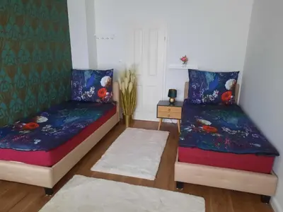 Ein Bett oder Betten in einem Zimmer der Unterkunft ROYAL APARTmENT