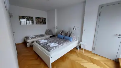 Ein Bett oder Betten in einem Zimmer der Unterkunft aeki CITY