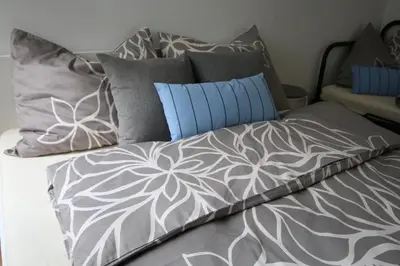 Ein Bett oder Betten in einem Zimmer der Unterkunft aeki CITY