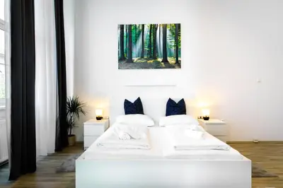 Ein Bett oder Betten in einem Zimmer der Unterkunft Apartments 4 you