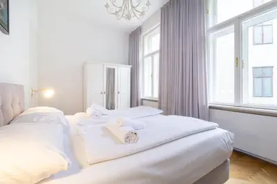 Ein Bett oder Betten in einem Zimmer der Unterkunft Large Luxury Residence Near Townhall & Votivkirche