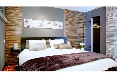 Ein Bett oder Betten in einem Zimmer der Unterkunft White Villa