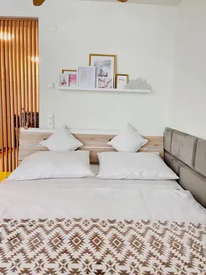 Ein Bett oder Betten in einem Zimmer der Unterkunft MollArt Apartment