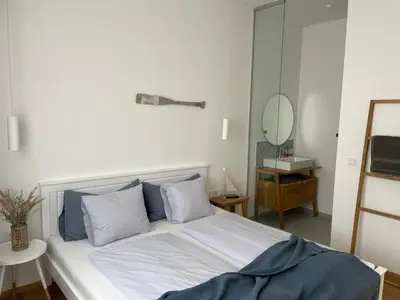 Ein Bett oder Betten in einem Zimmer der Unterkunft Pannonia Apartments