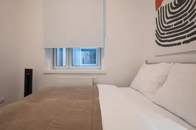 Ein Bett oder Betten in einem Zimmer der Unterkunft Contemporary 1-Bed Apartment with Balcony in the Heart of Vienna