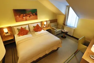 Ein Bett oder Betten in einem Zimmer der Unterkunft Hotel Leobersdorfer Hof