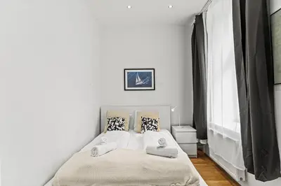 Ein Bett oder Betten in einem Zimmer der Unterkunft Cozy Apartment near City Center