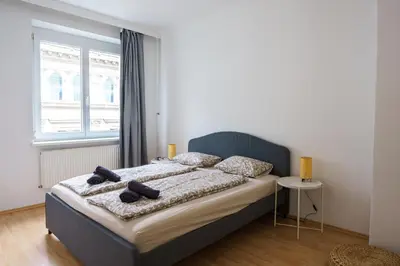 Ein Bett oder Betten in einem Zimmer der Unterkunft Vienna City Apartment Schottentor