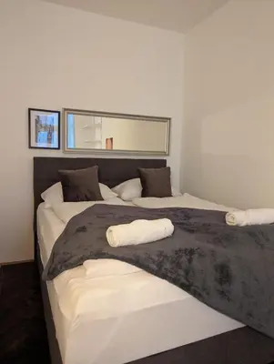 Ein Bett oder Betten in einem Zimmer der Unterkunft Big CityApartment 19
