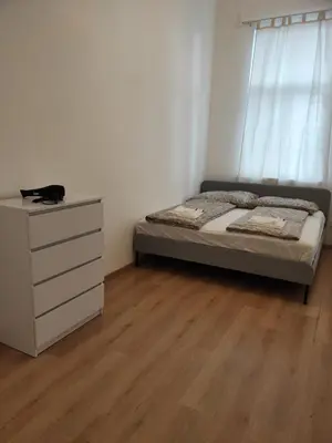 Ein Bett oder Betten in einem Zimmer der Unterkunft CozyNite Premium Apartment Hauptbahnhof 1+2