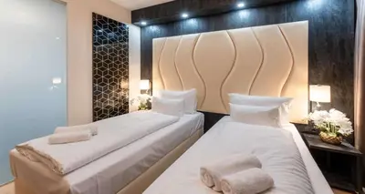 Ein Bett oder Betten in einem Zimmer der Unterkunft PLAZA INN Wiener Neustadt, BW Signature Collection