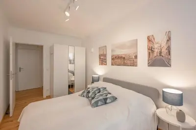 Ein Bett oder Betten in einem Zimmer der Unterkunft Modern City Center Apartment