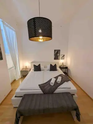 Ein Bett oder Betten in einem Zimmer der Unterkunft Luxury CityApartment 7