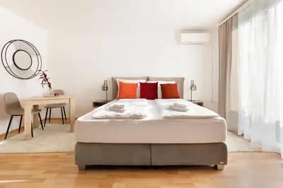 Ein Bett oder Betten in einem Zimmer der Unterkunft NEU! Apartment mit Klimaanlage, nahe Hauptbahnhof