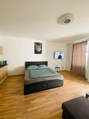 Ein Bett oder Betten in einem Zimmer der Unterkunft Siebenbrunneng. Nice