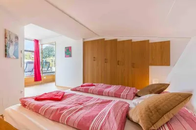 Ein Bett oder Betten in einem Zimmer der Unterkunft Whirlpool , Dachterrasse , Wienblick , zwei Etagen
