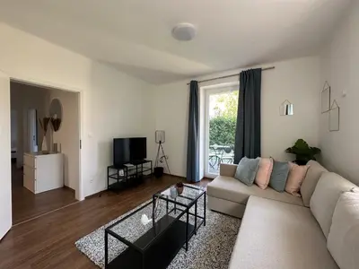 Ein Sitzbereich in der Unterkunft FeelHome-GolfClub-Terrasse-6 Gäste-WiFi-Smart TV
