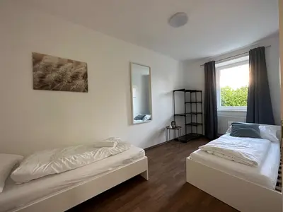Ein Bett oder Betten in einem Zimmer der Unterkunft FeelHome-GolfClub-Terrasse-6 Gäste-WiFi-Smart TV