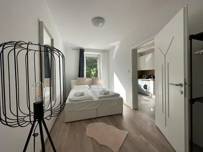 Ein Bett oder Betten in einem Zimmer der Unterkunft FeelHome-GolfClub-Balkon-4 Gäste-WiFi-Smart TV