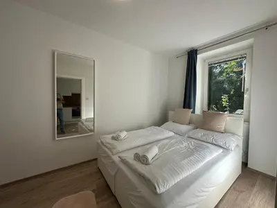 Ein Bett oder Betten in einem Zimmer der Unterkunft FeelHome-GolfClub-Balkon-4 Gäste-WiFi-Smart TV