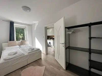 Ein Bett oder Betten in einem Zimmer der Unterkunft FeelHome-GolfClub-Balkon-4 Gäste-WiFi-Smart TV