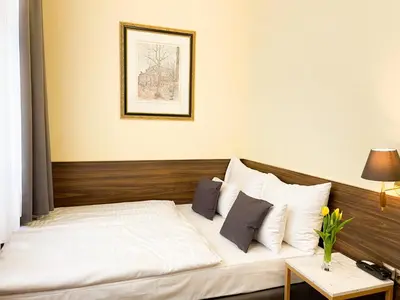 Ein Bett oder Betten in einem Zimmer der Unterkunft City Pension Stephansplatz I Self Check In