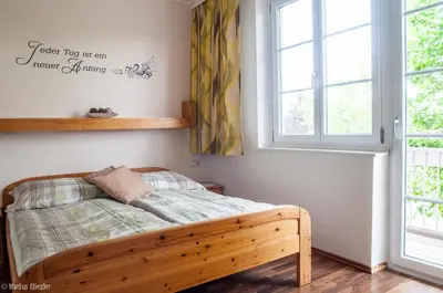 Ein Bett oder Betten in einem Zimmer der Unterkunft Gästehaus Ringbauer